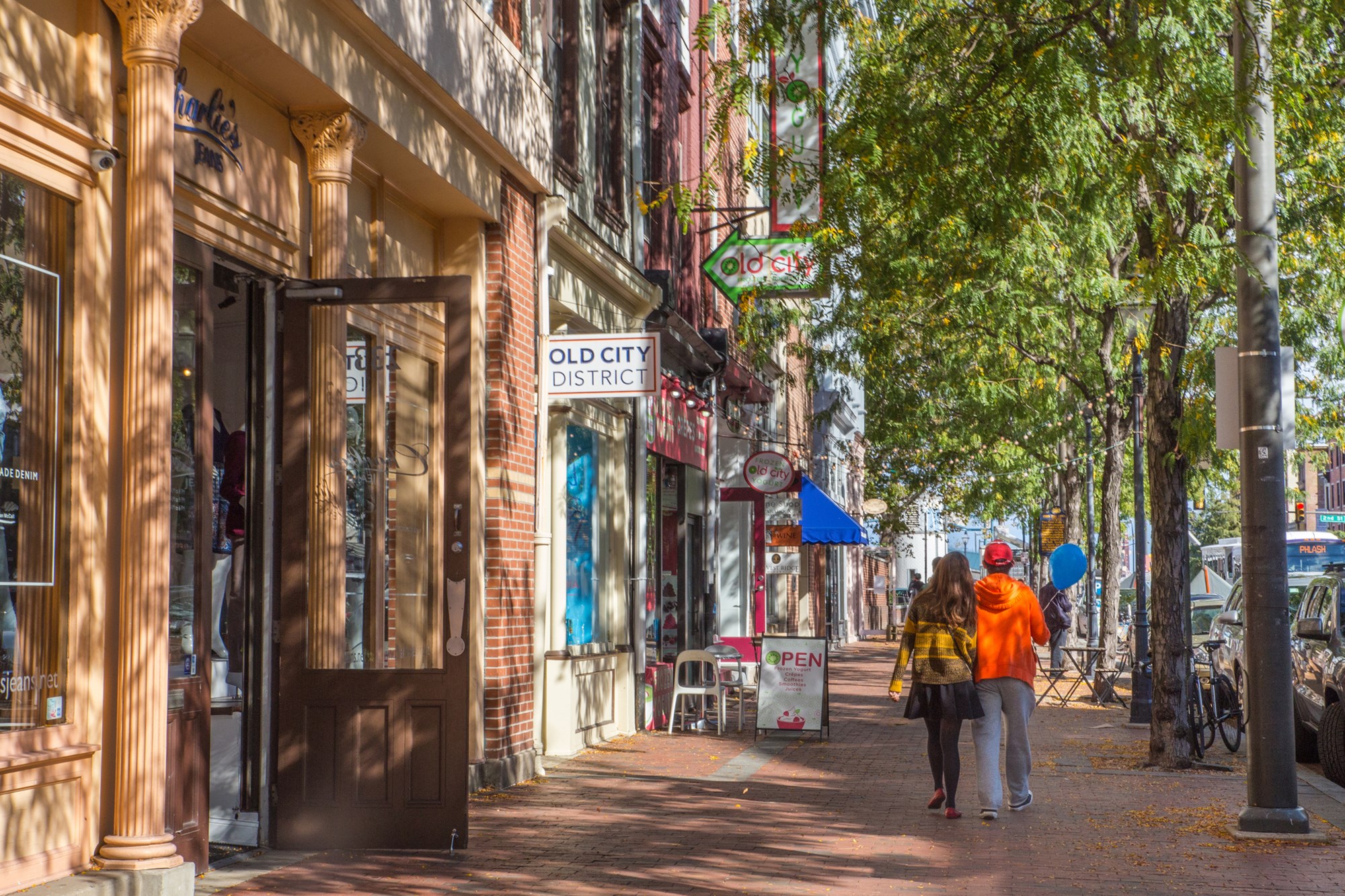 Philadelphia, Pennsylvania, USA - October 9, 2016: Street view along landmark Market Street in Old City Philadelphia, PA with people in view. Old City is well known for it's many historical sites.