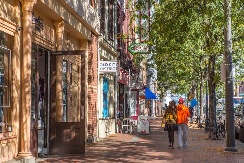 Philadelphia, Pennsylvania, USA - October 9, 2016: Street view along landmark Market Street in Old City Philadelphia, PA with people in view. Old City is well known for it's many historical sites.